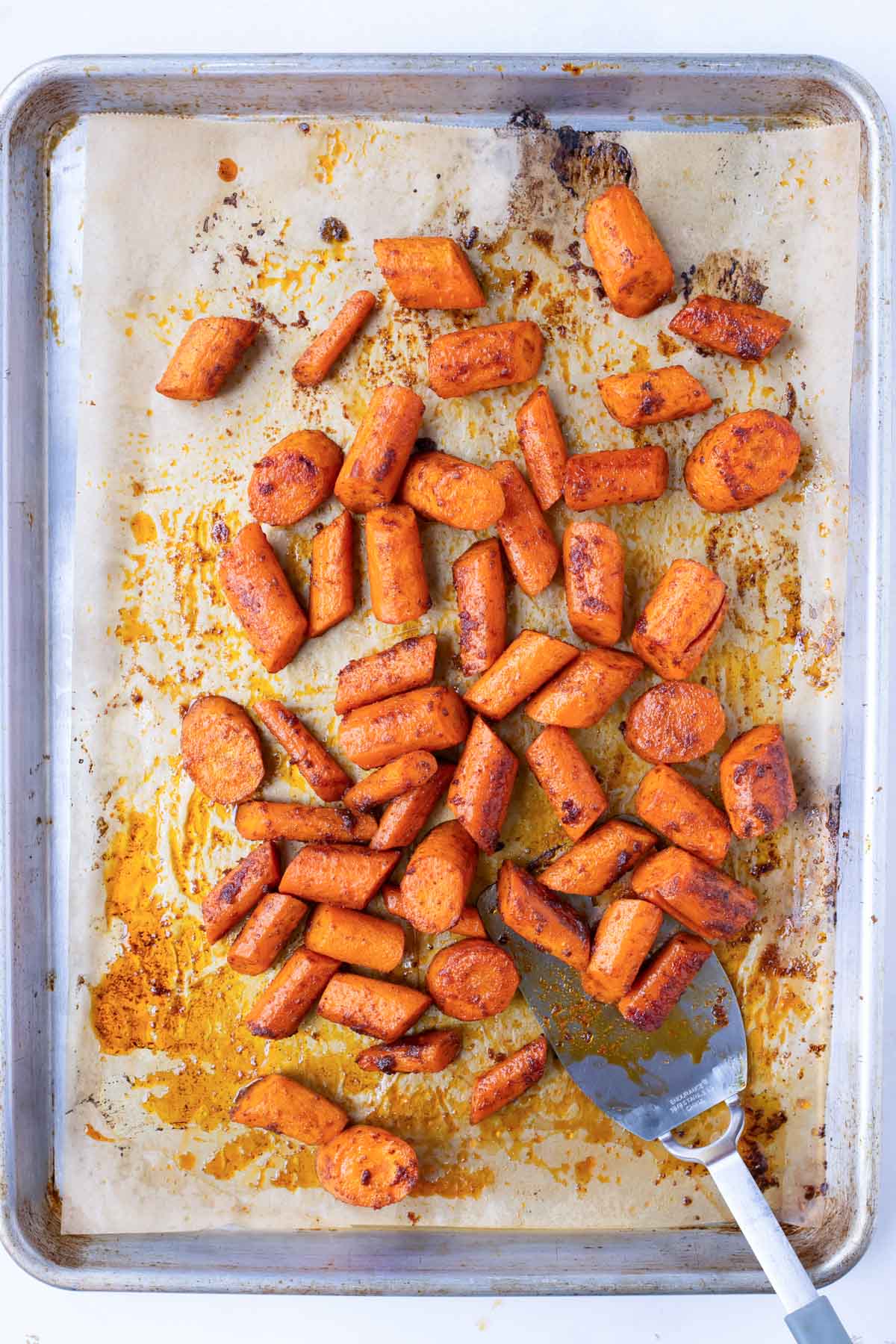 Spiced carrots are roasted in the oven.