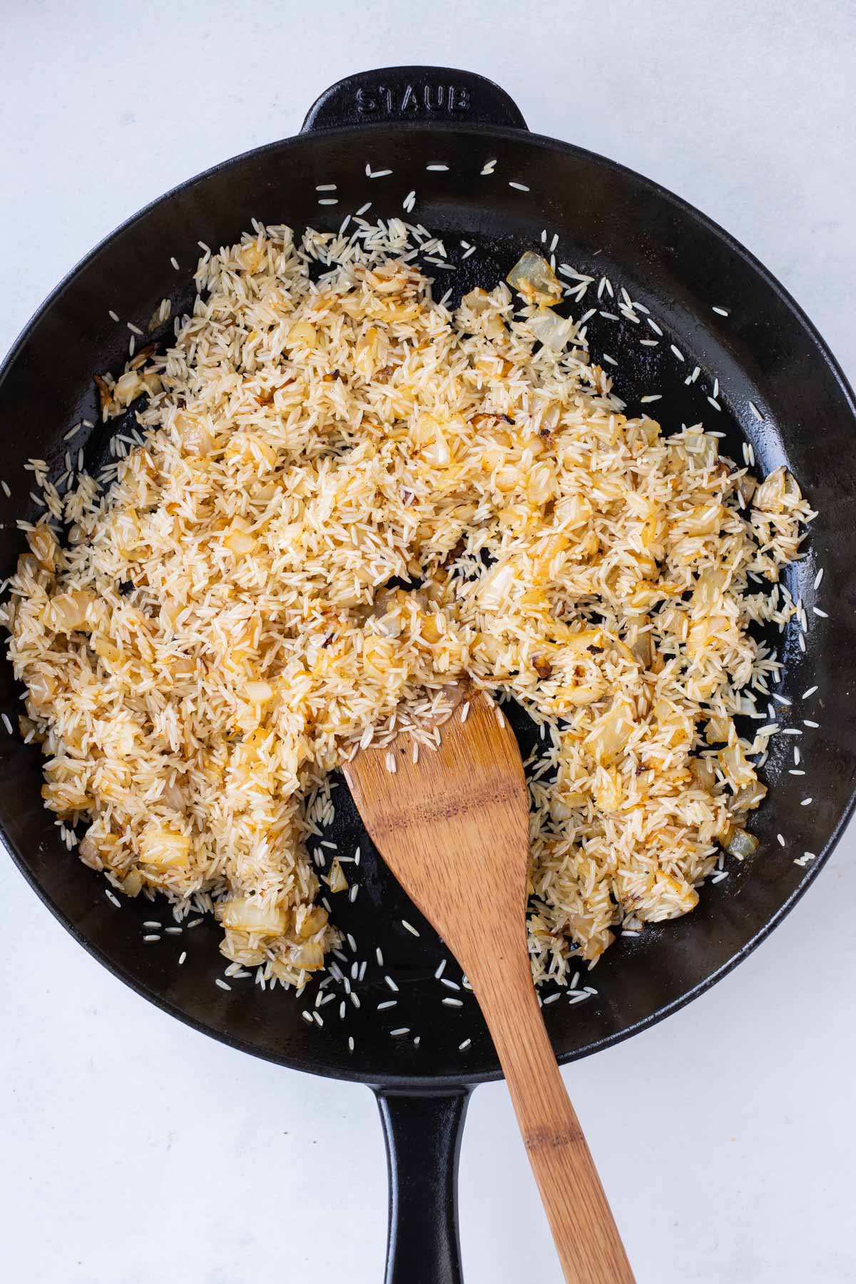 Rice is added to the skillet.
