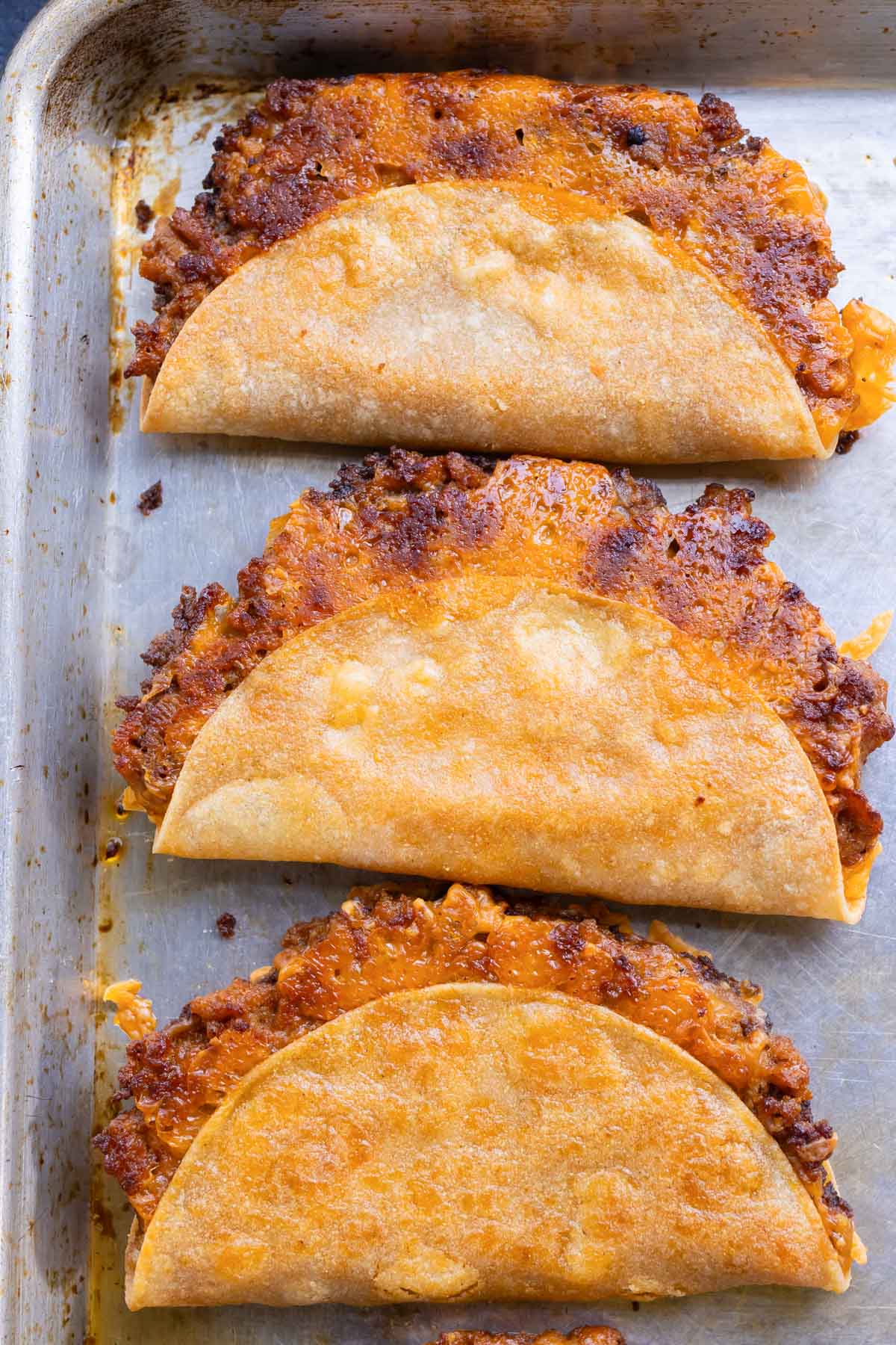Three turkey tacos are perfectly crisp after baking.