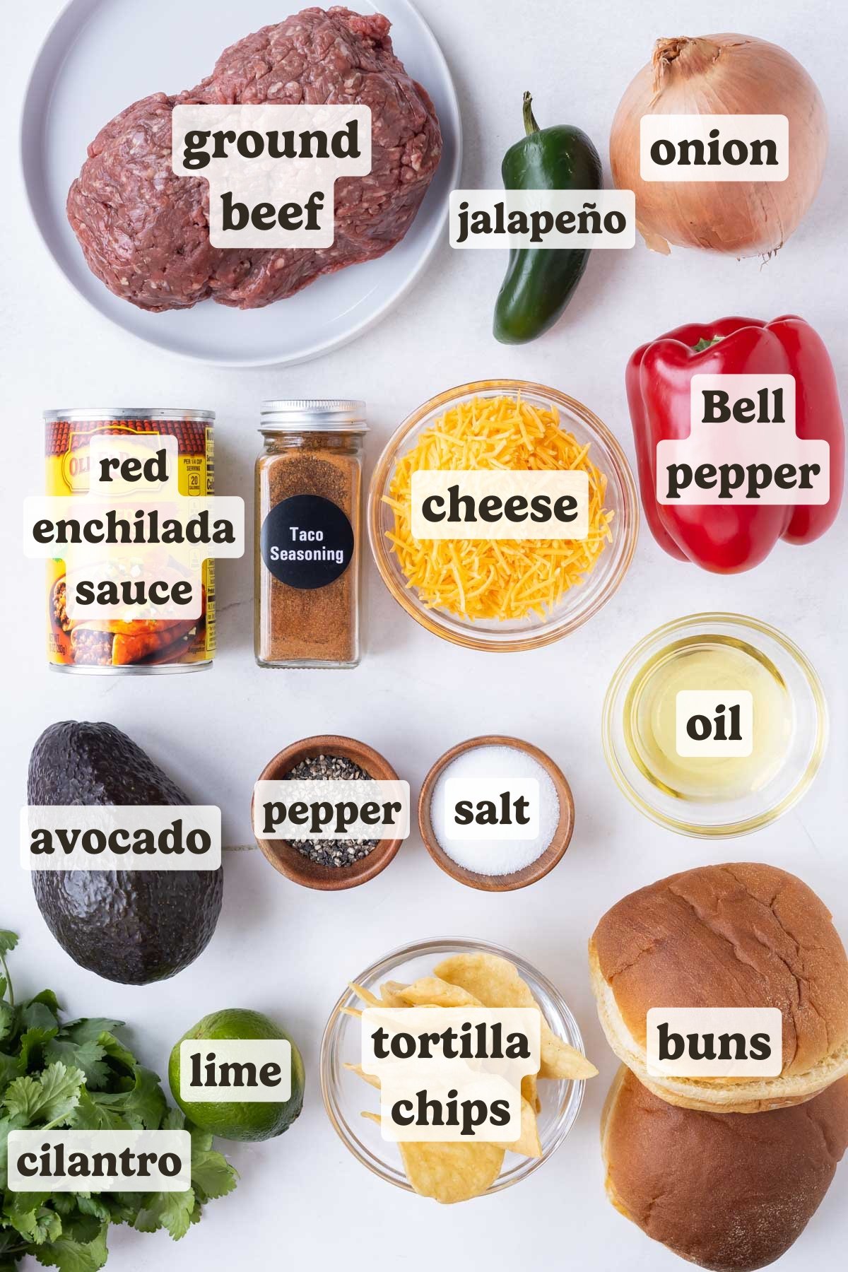 Ground beef, enchilada sauce, onion, bell pepper, avocado, cilantro, and buns are the main ingredients for these enchilada burgers.