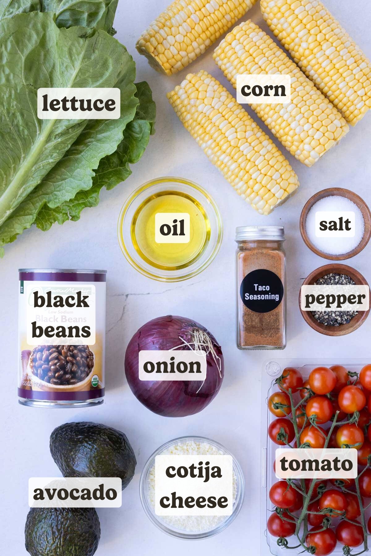 Lettuce, corn, black beans, onion, tomato, avocado, and seasonings are the main ingredients for this steak salad recipe.