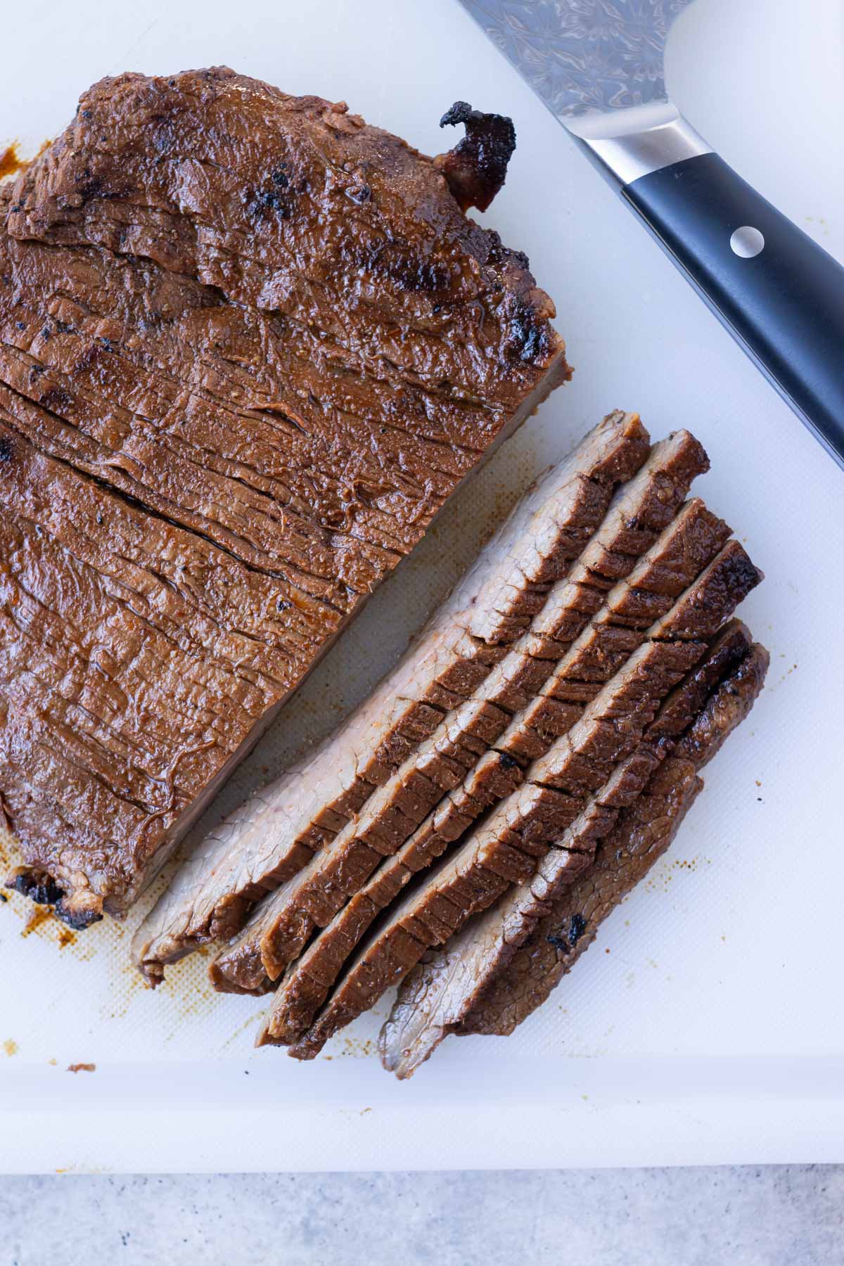 Grilled fajita steak is sliced thinly against the grain for a salad.