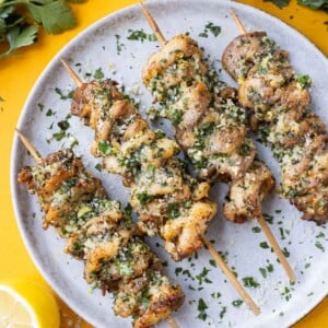 Chicken thighs are seasoned with Parmesan and garlic, then skewered and cooked in an air fryer.