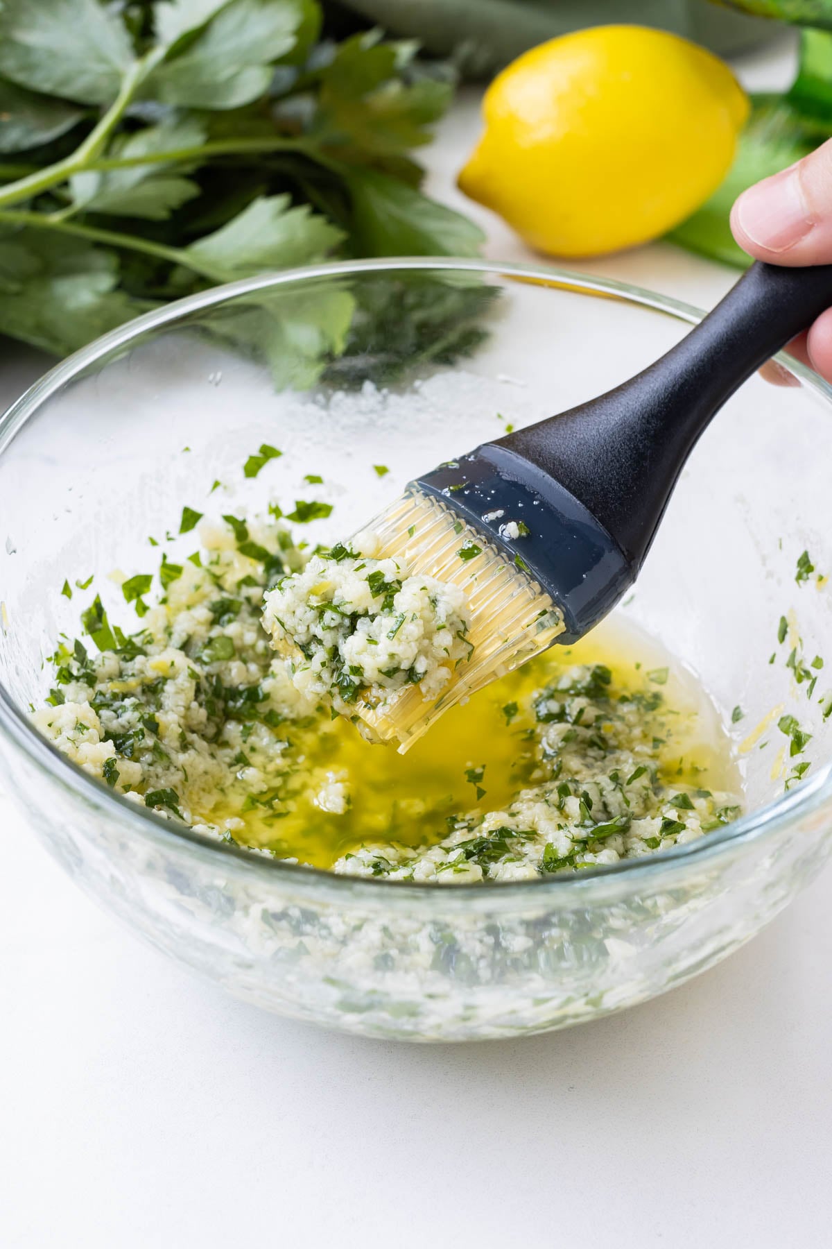 A garlic Parmesan sauce is mixed together.