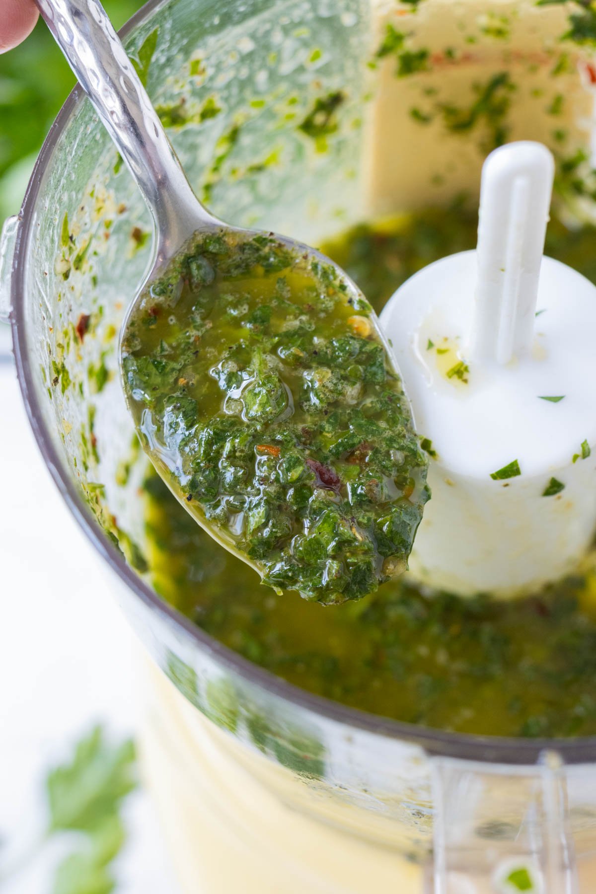 Chimichurri sauce is processed until smooth.