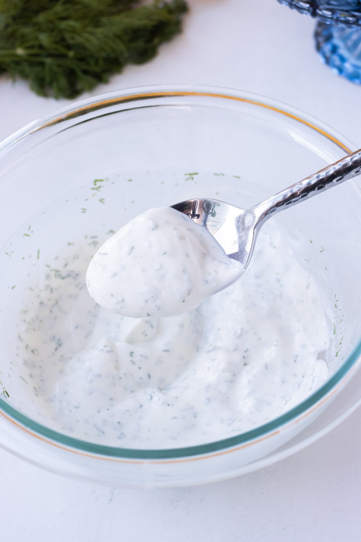 The Greek yogurt sauce is stirred together.