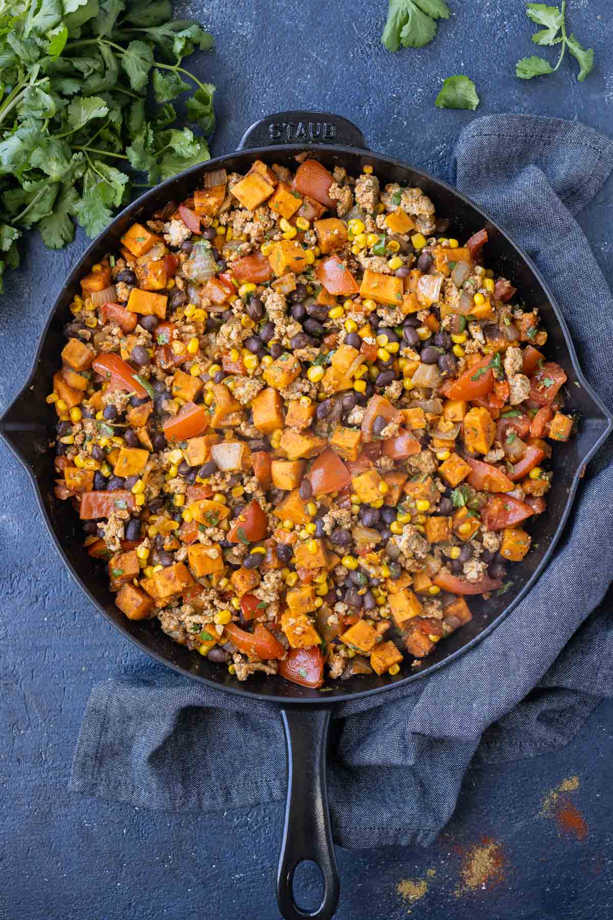Ground turkey is added back into the sweet potato mixture.