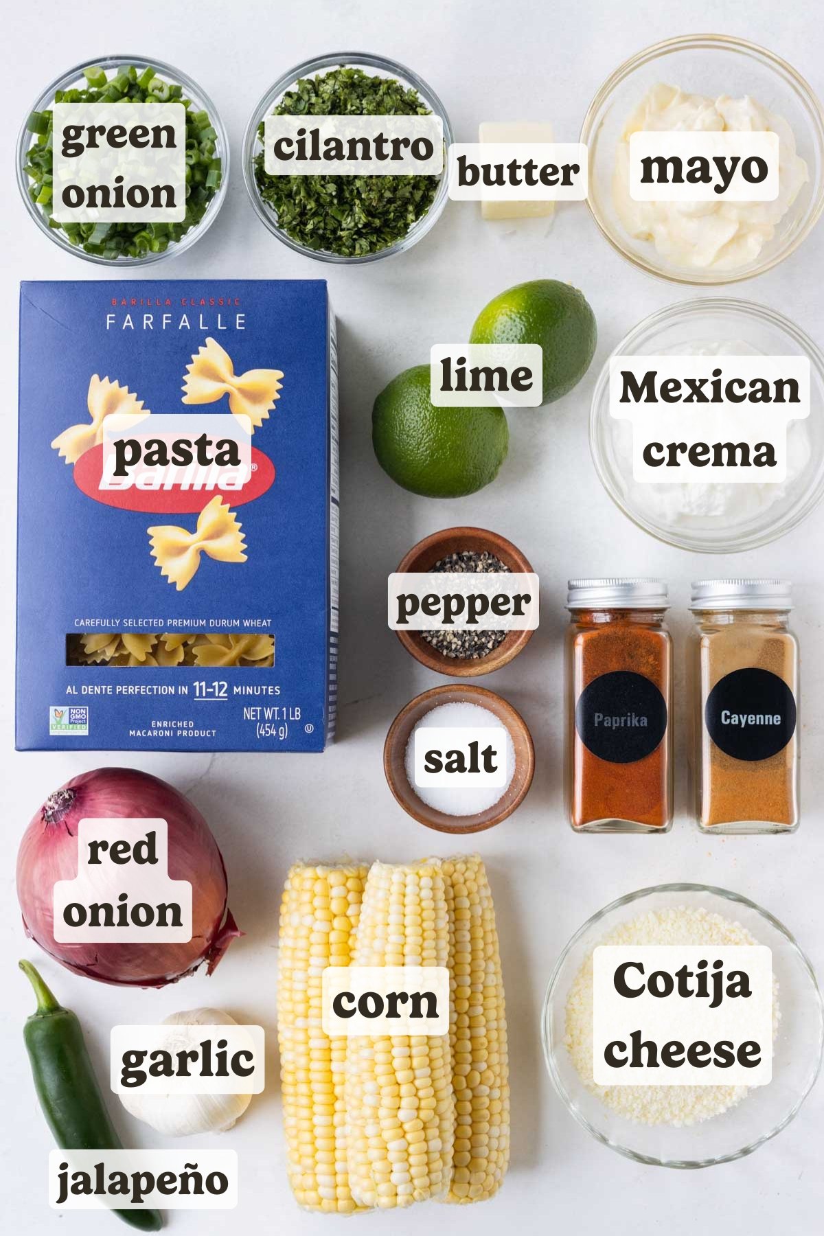 Pasta, corn, cilantro, green onion, lime, mayo, Mexican crema, and garlic are some of the main ingredients of this street corn pasta salad.