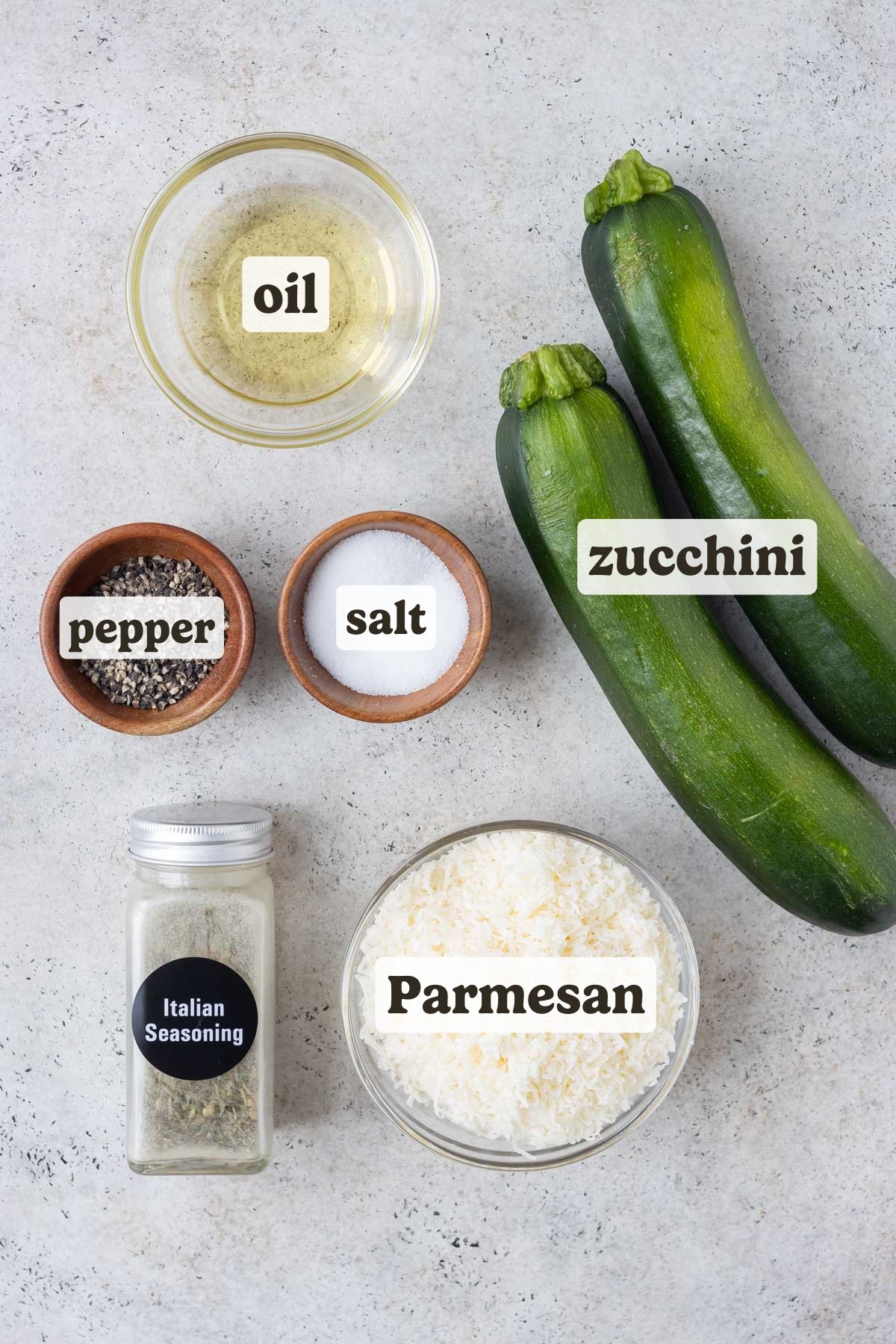 Zucchini, Parmesan, salt, pepper, and oil are the main ingredients for this Parmesan crusted zucchini recipe.