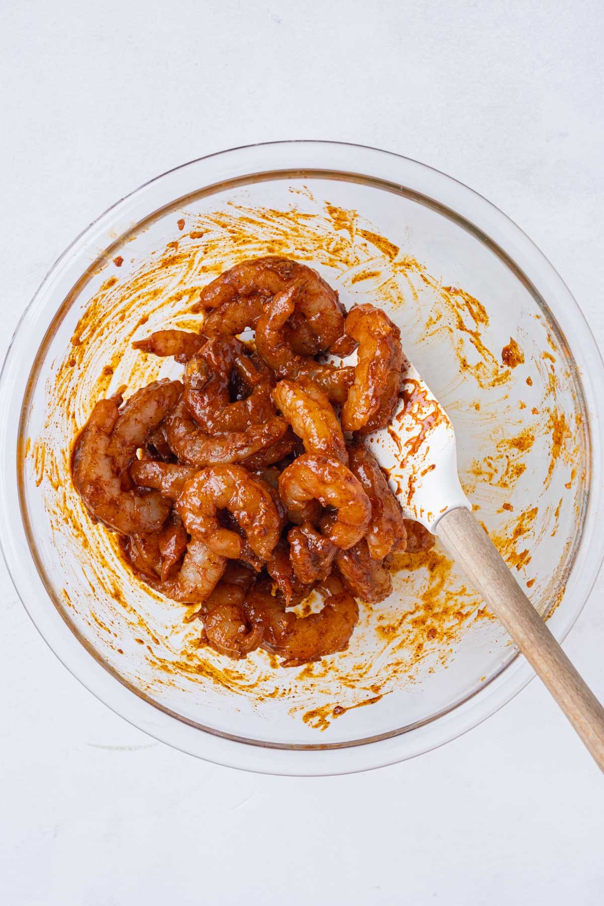 Shrimp is seasoned with a marinade.