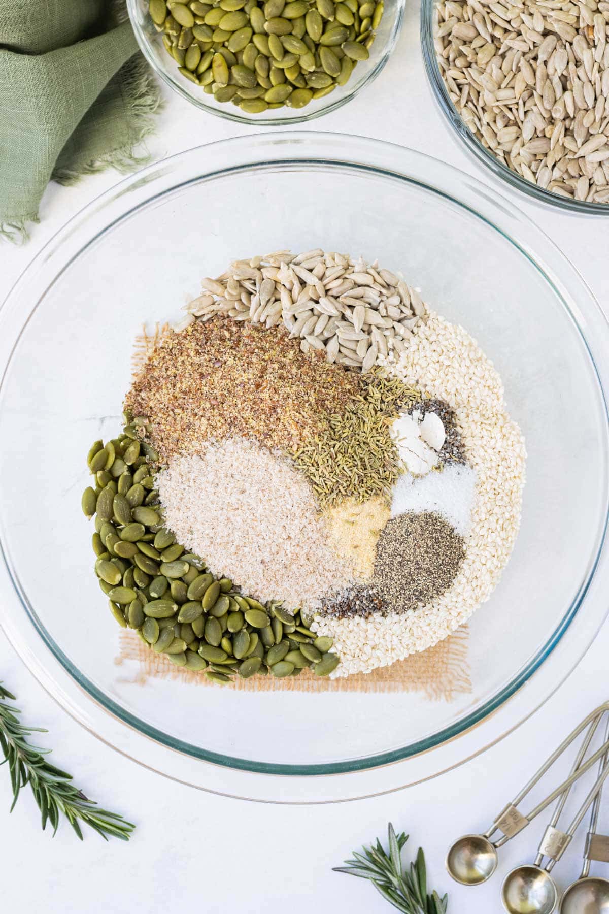 All of dry ingredients for the crackers are added to a bowl.