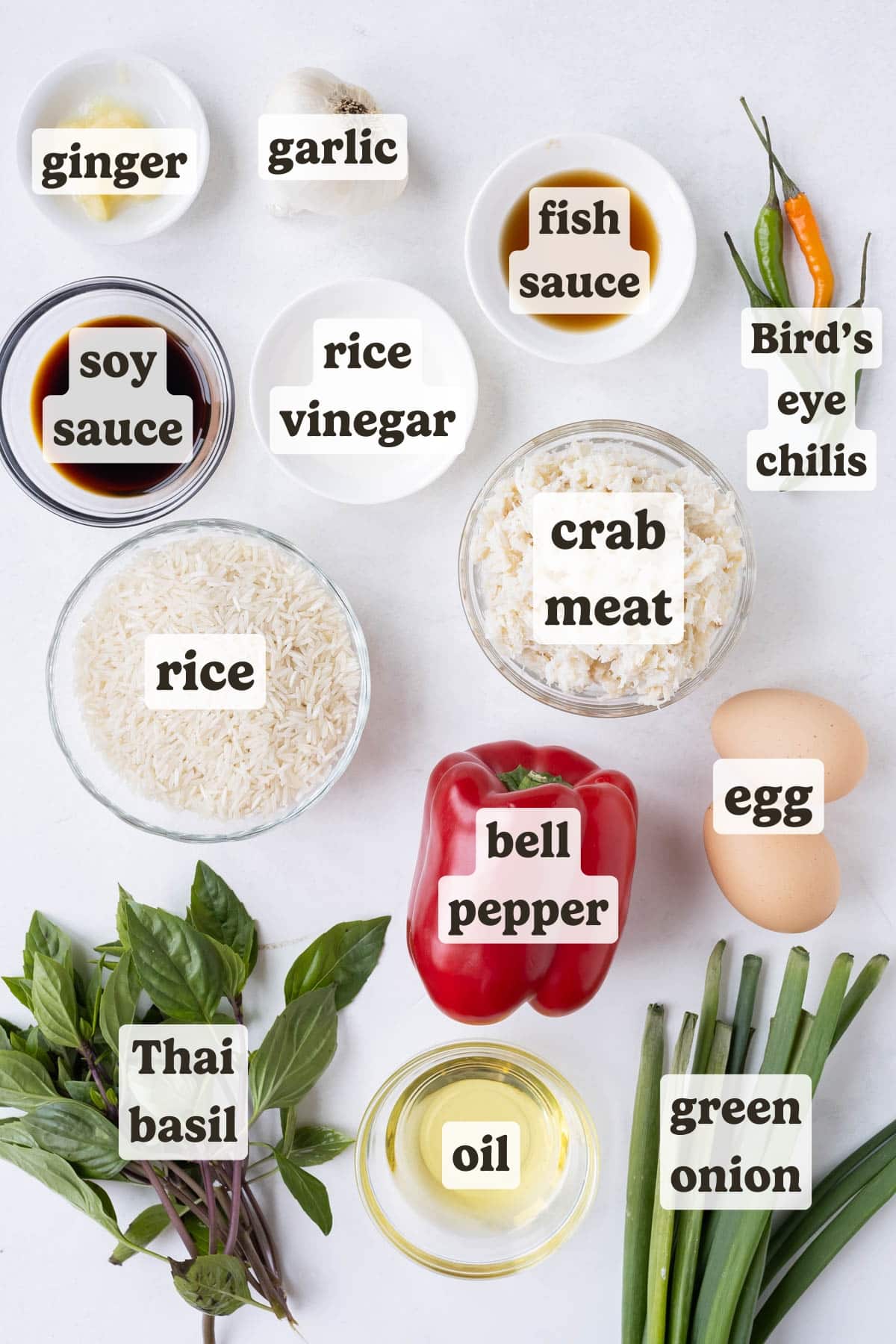 Rice, crab meat, soy sauce, Bird's eye chili, egg, and ginger are some of the main ingredients for this Thai Crab Fried Rice recipe.