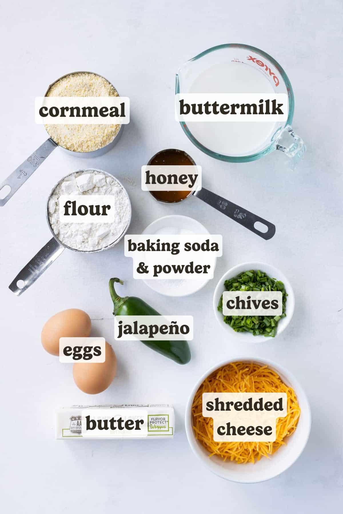 Cornmeal, flour, eggs, butter, and cheese are the main ingredients for the cornbread in this skillet recipe.