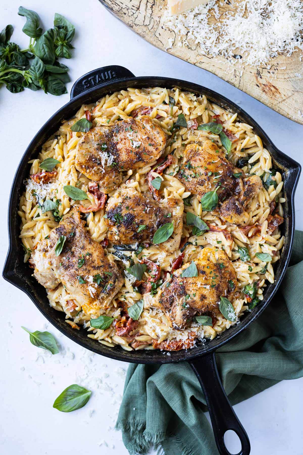 A Marry Me Chicken is combined with creamy orzo, sun-dried tomatoes, spinach and basil in an easy one-pot recipe.
