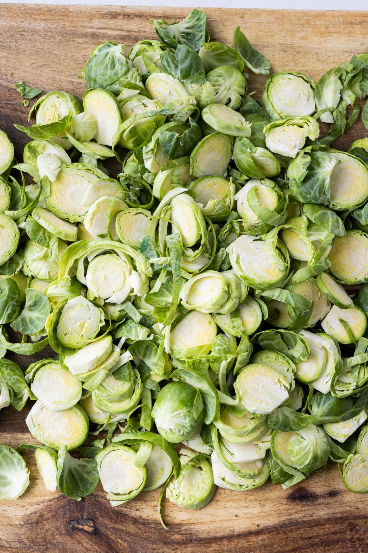 Sliced Brussels sprouts are prepared before baking.