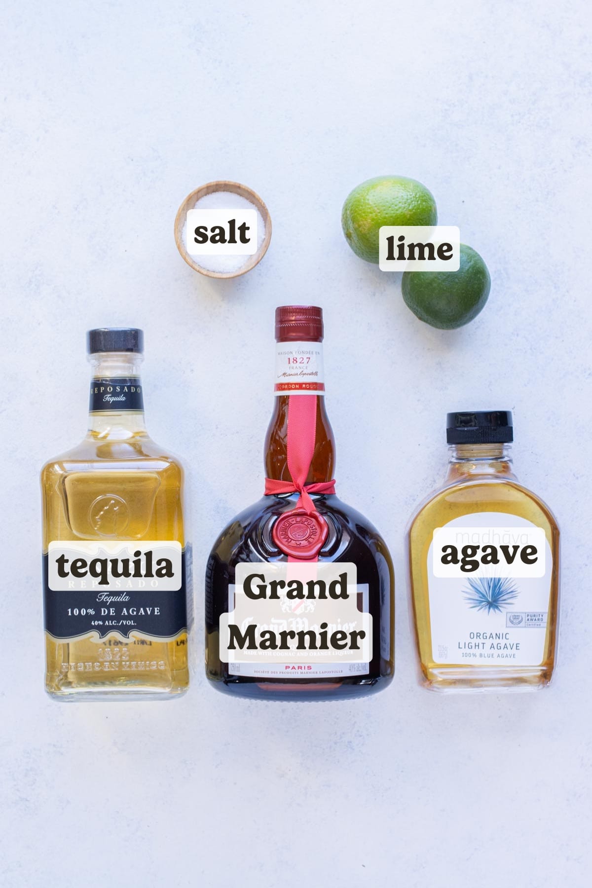 Limes, tequila, Grand Mariner, Agave, and salt are the ingredients for this Cadillac margarita.