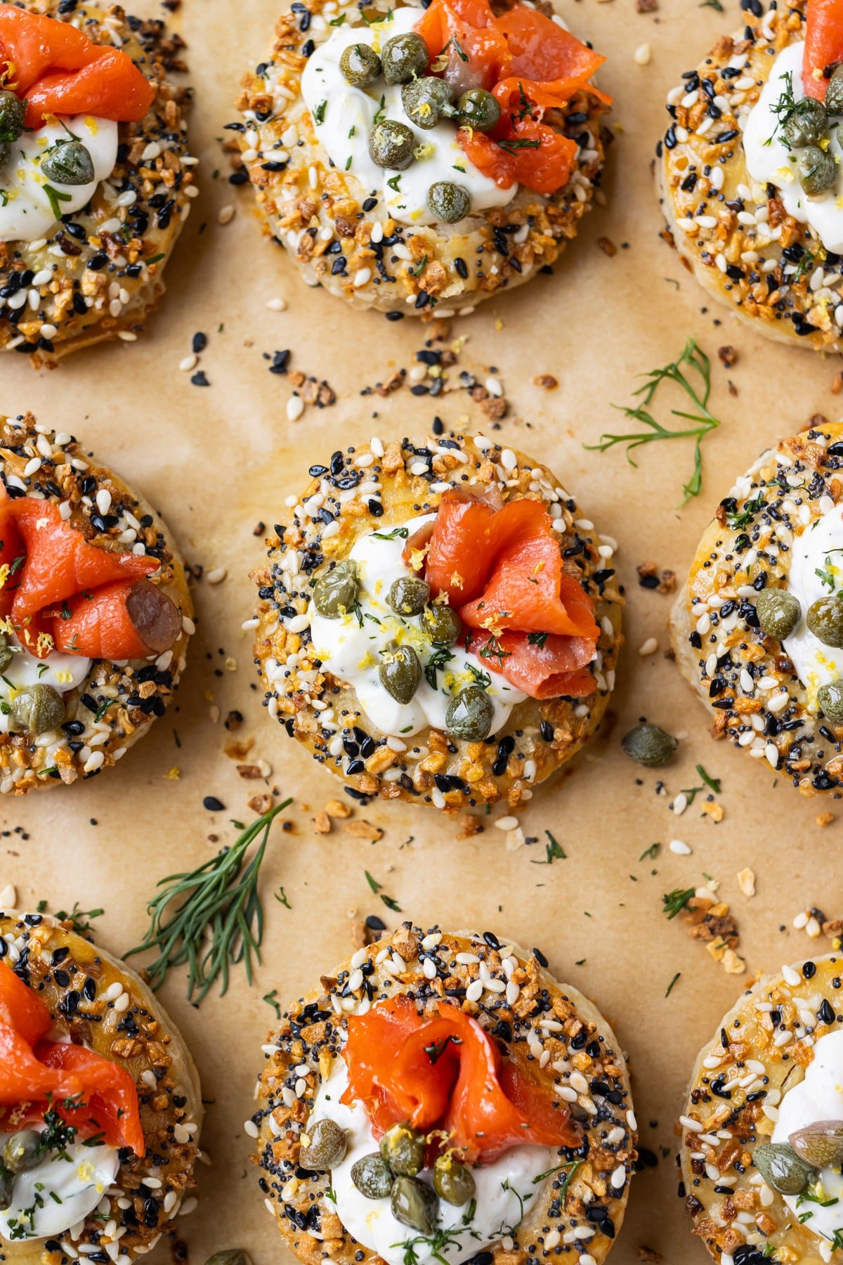 Everything Bagel Salmon Cream Puffs with capers and dill are on a tray for serving.