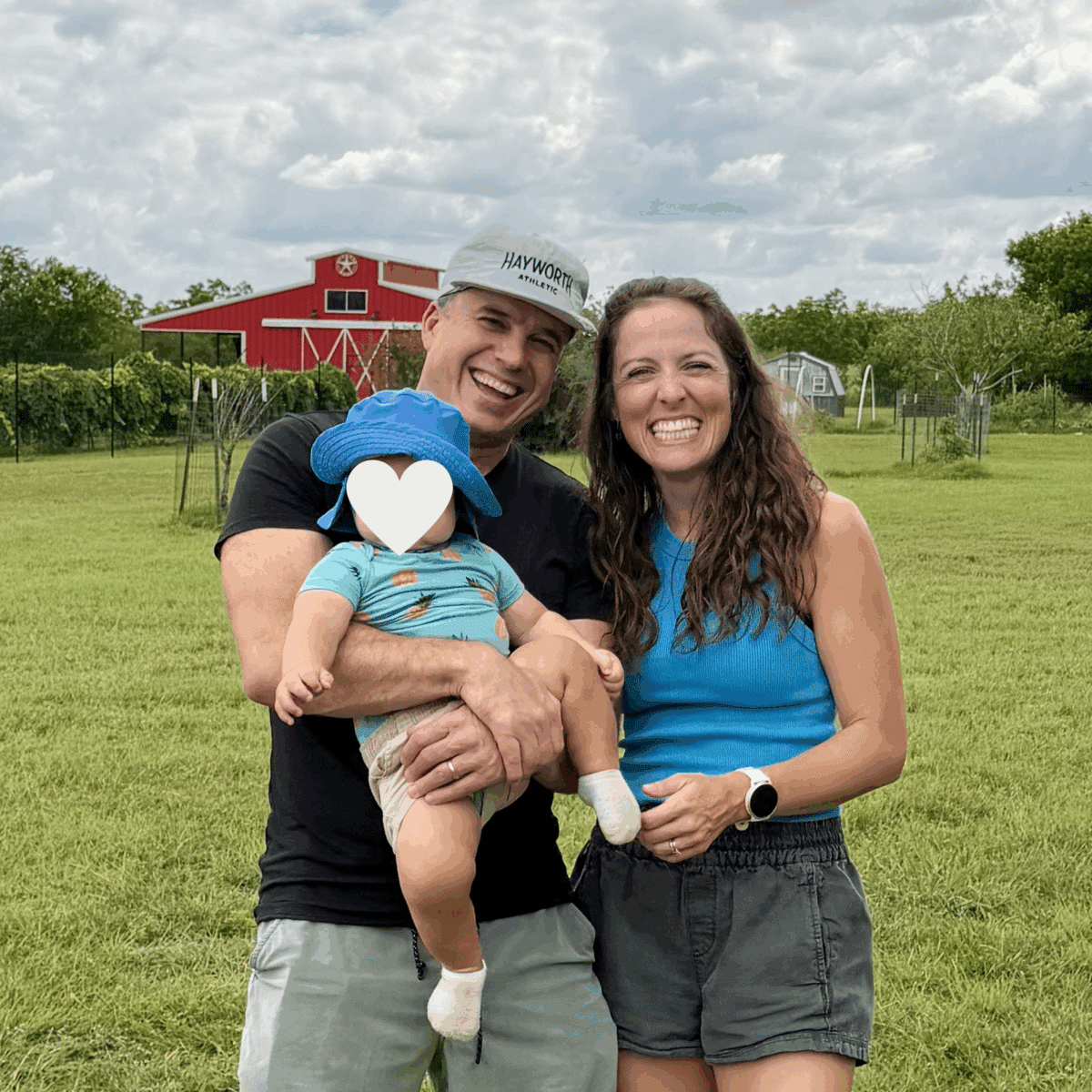 London Lea, Justin Lea, and their son on her mom's family farm getting zucchini and squash.