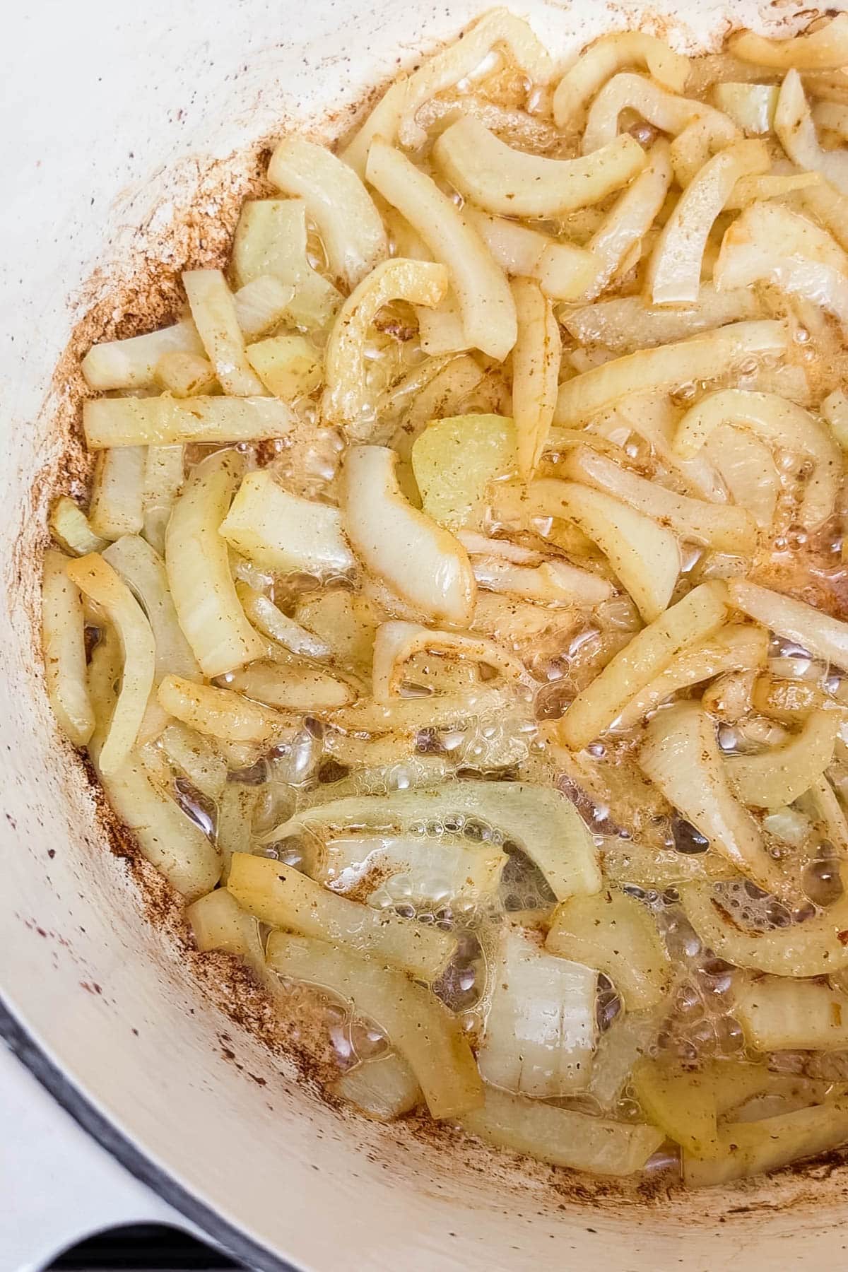 Fennel being caramelizing in a pot for a potato leek fennel soup.