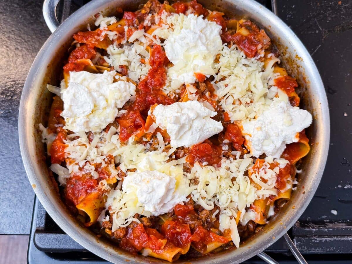 Ricotta and mozzarella are added to the top of this one-pot lasagna.