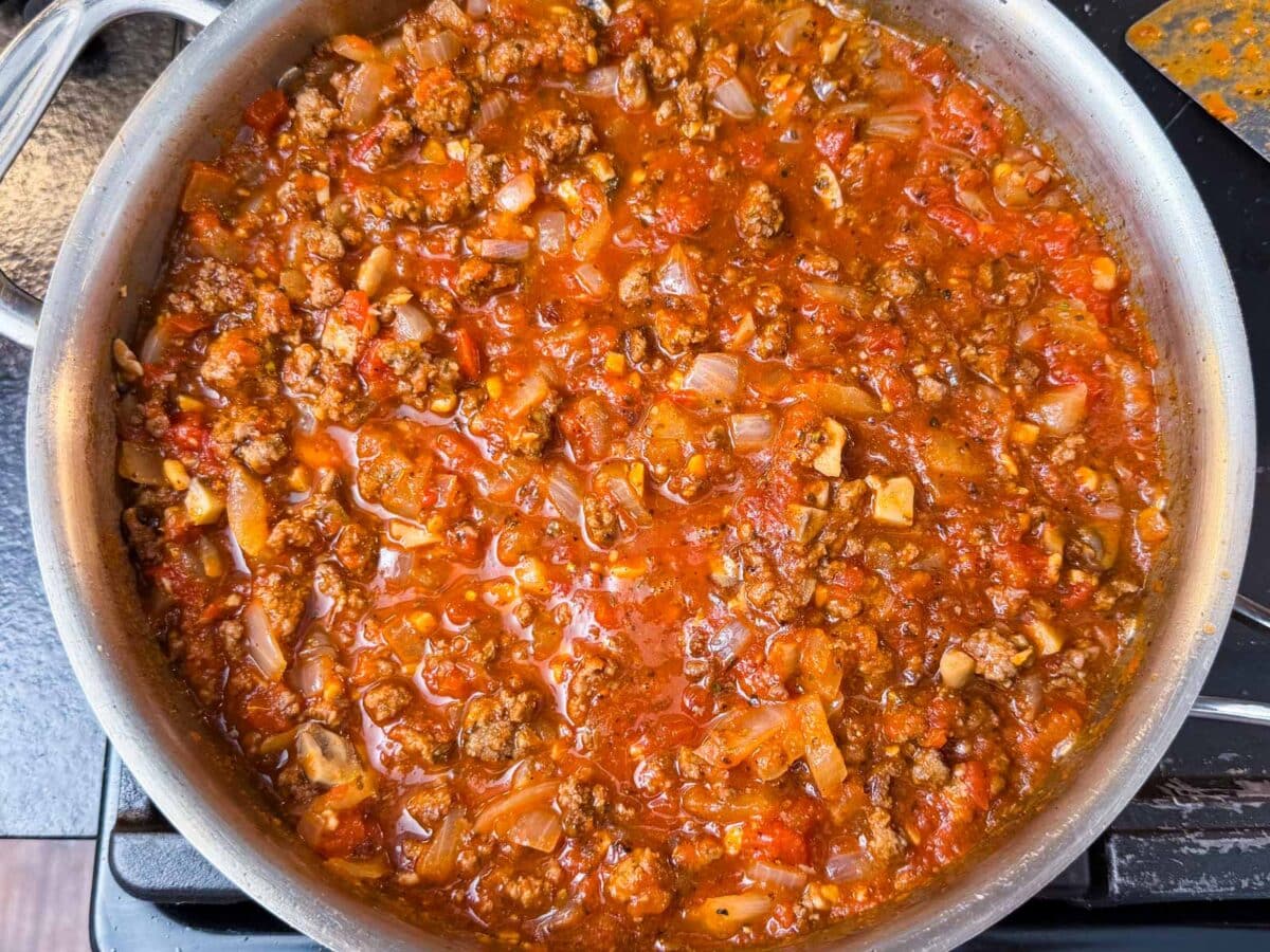 Marinara is added to the meat base of this lasagna dish.