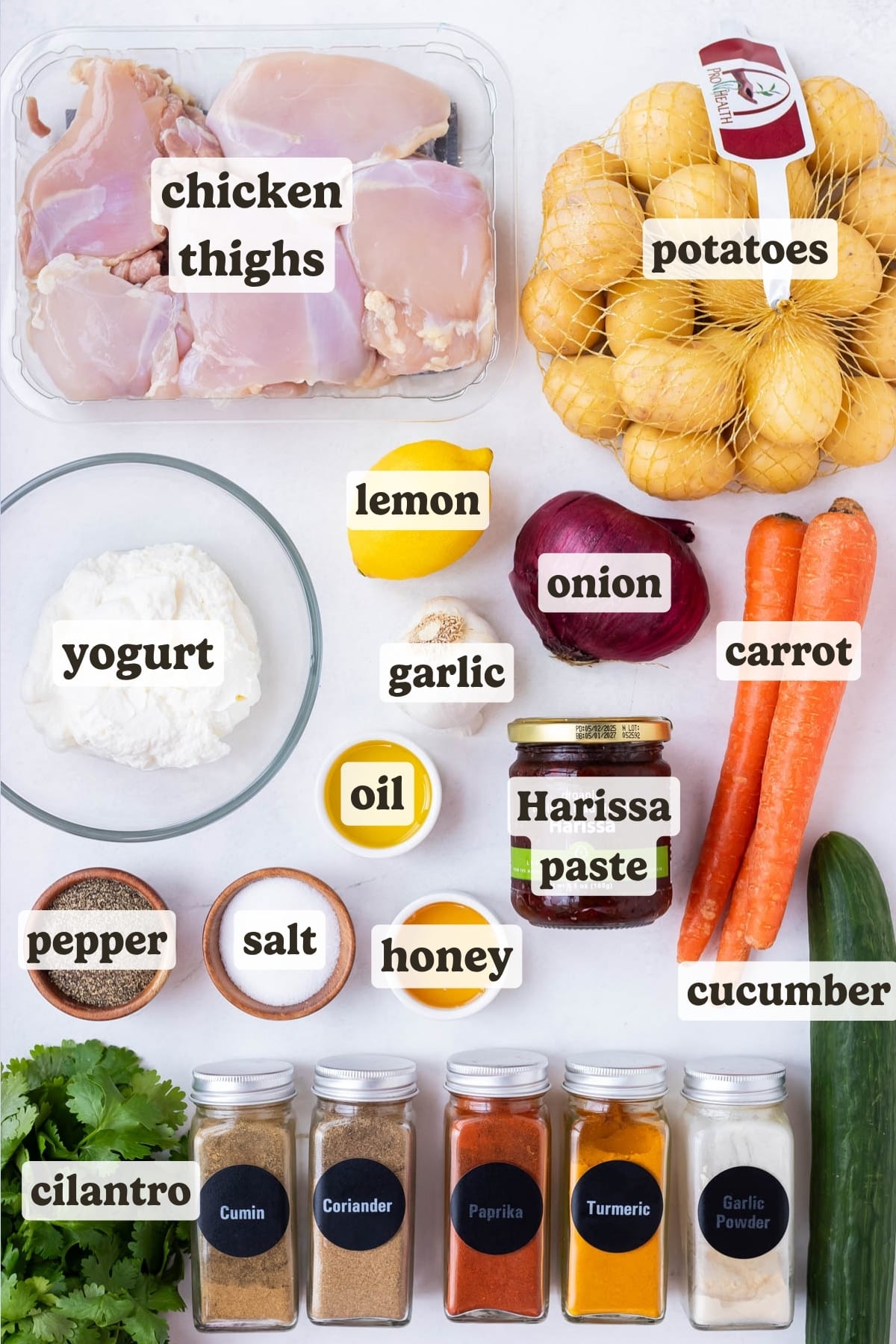 Chicken thighs, honey, potatoes, carrots, cucumber, yogurt, and spices are the main ingredients for this Harissa honey chicken recipe.