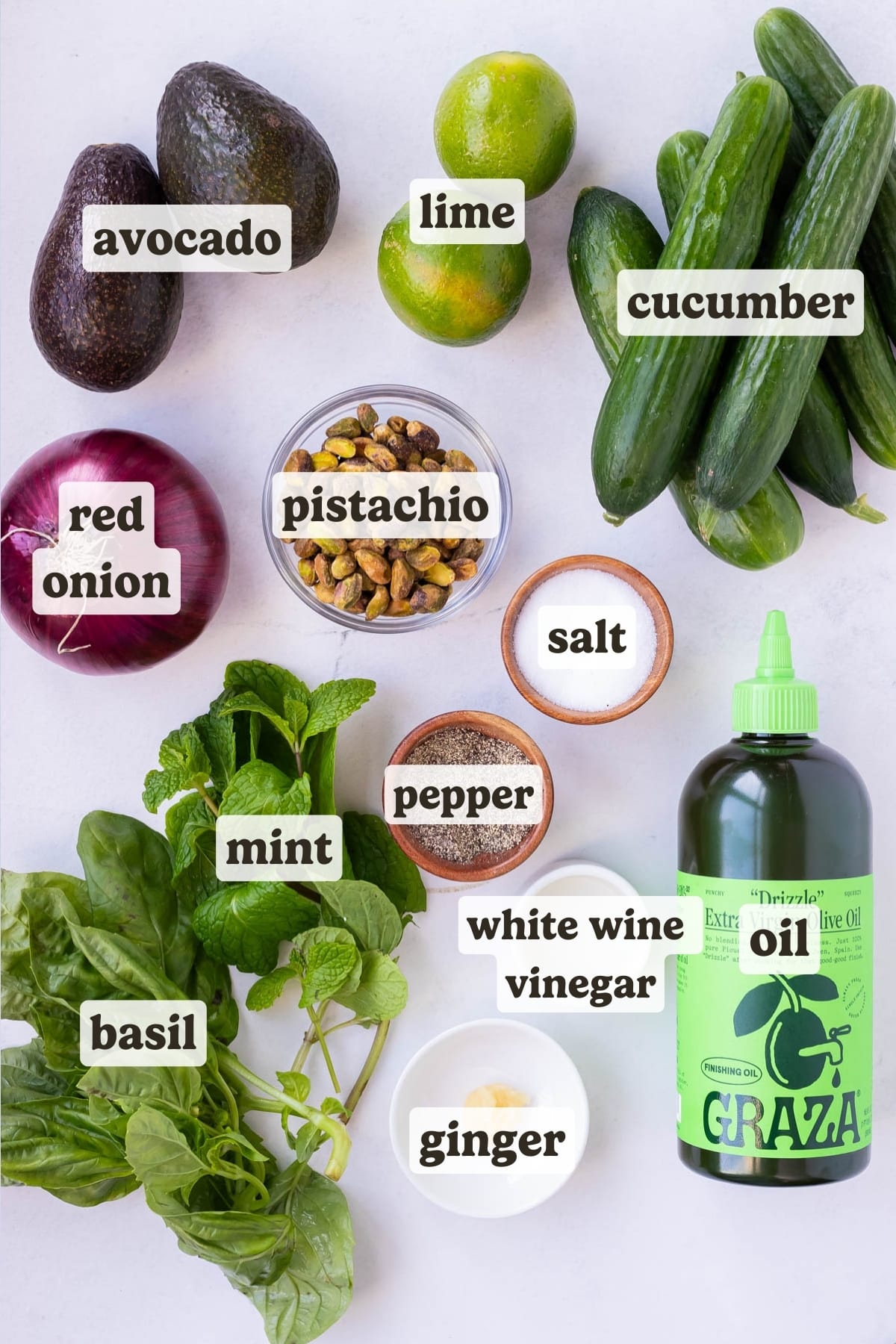 Avocado, cucumber, lime, onion, pistachio, basil, mint, and seasonings are the main ingredients for this pistachio cucumber salad.