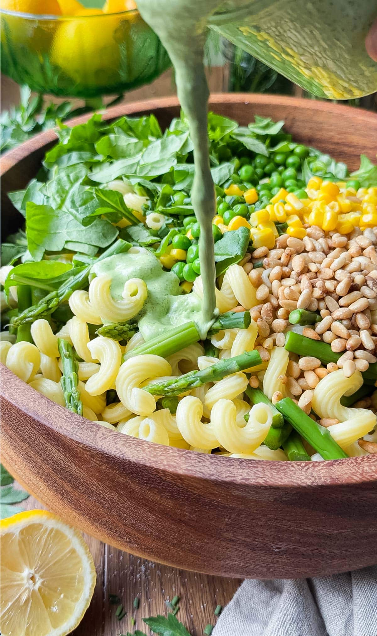 Green goddess pasta salad served in a bowl with fresh herbs