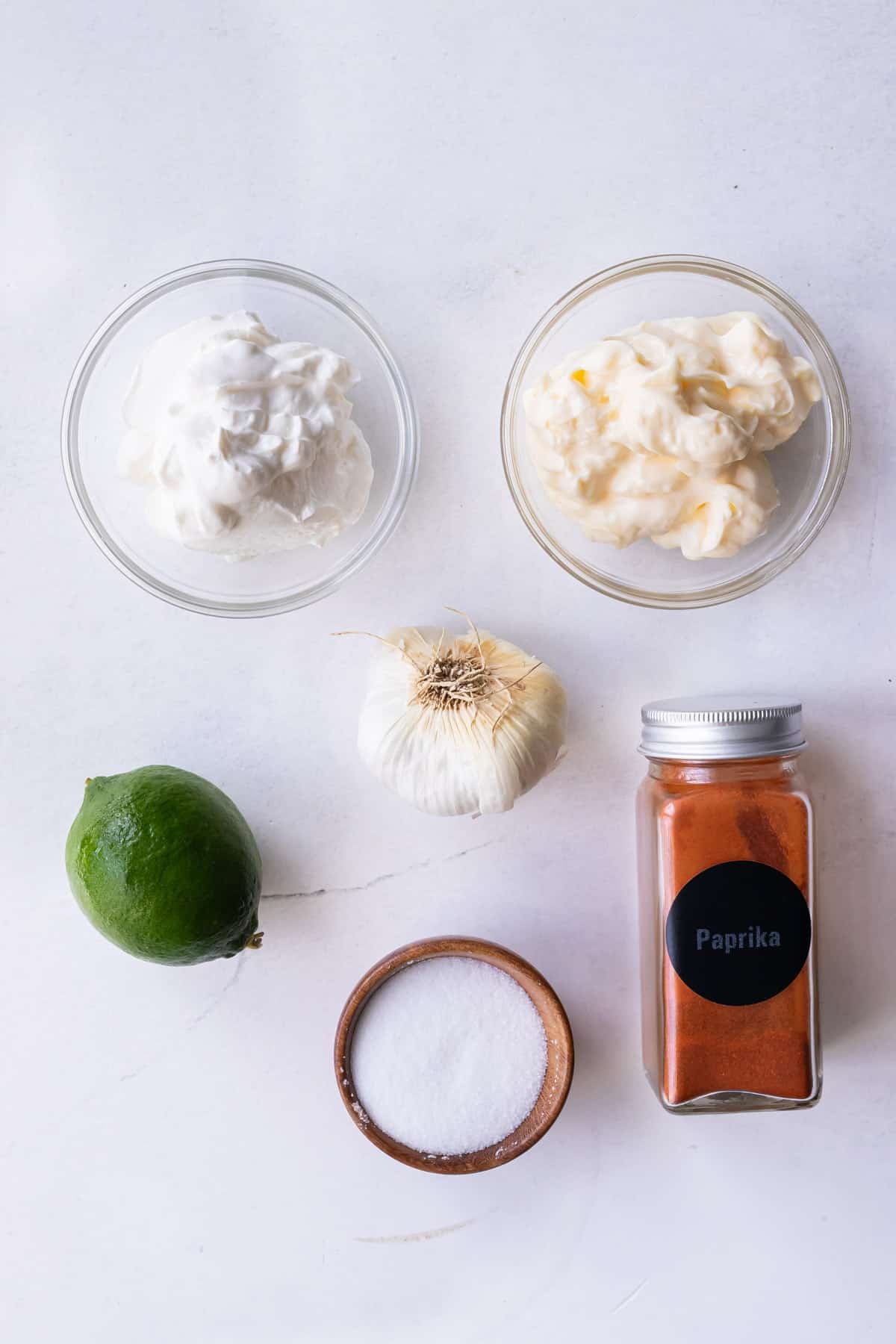 Mexican crema or sour cream, mayonnaise, garlic, lime, and chili powder are the ingredients for a chili-lime crema sauce.