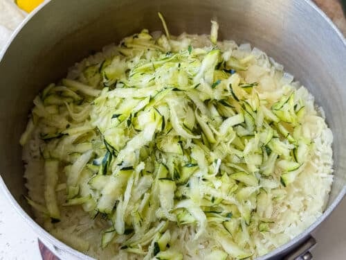 Grated zucchini stirred into cooked rice for zucchini rice