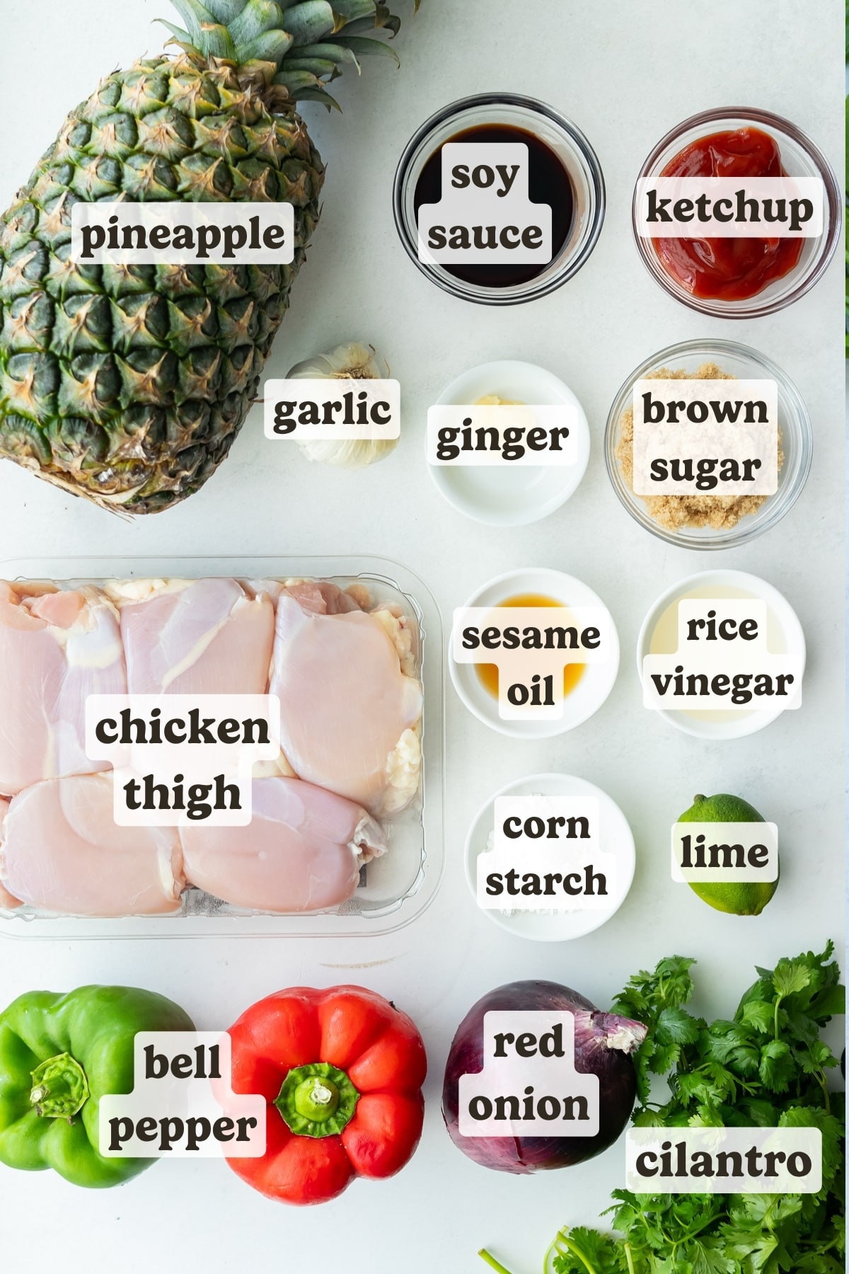 Chicken thighs, a pineapple, marinade ingredients, bell peppers, and a red onion are the ingredients needed for a sheet pan hawaiian chicken recipe.