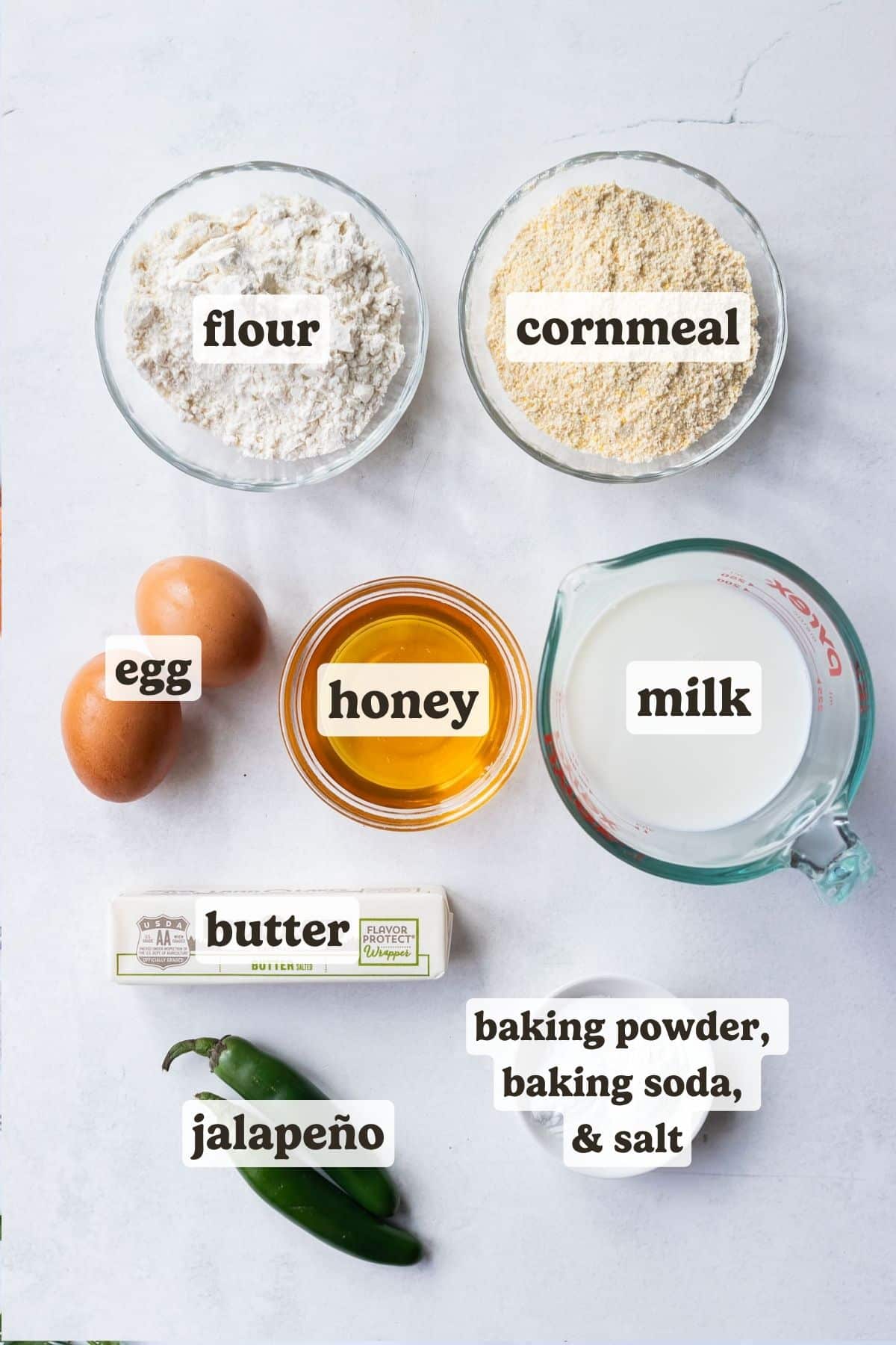Flour, cornmeal, eggs, honey, milk, buttter, and jalapenos are the ingredients needed for this honey jalapeno cornbread topping.