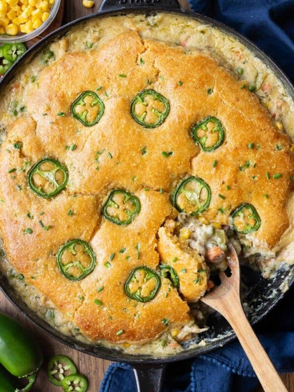 Cornbread Chicken Pot Pie is served in one pan with a jalapeno topping and honey butter.