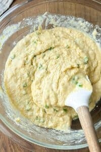 Honey jalapeno cornbread is mixed together in a bowl.