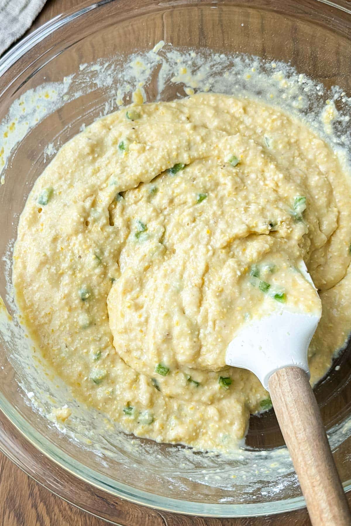 Honey jalapeno cornbread is mixed together in a bowl.