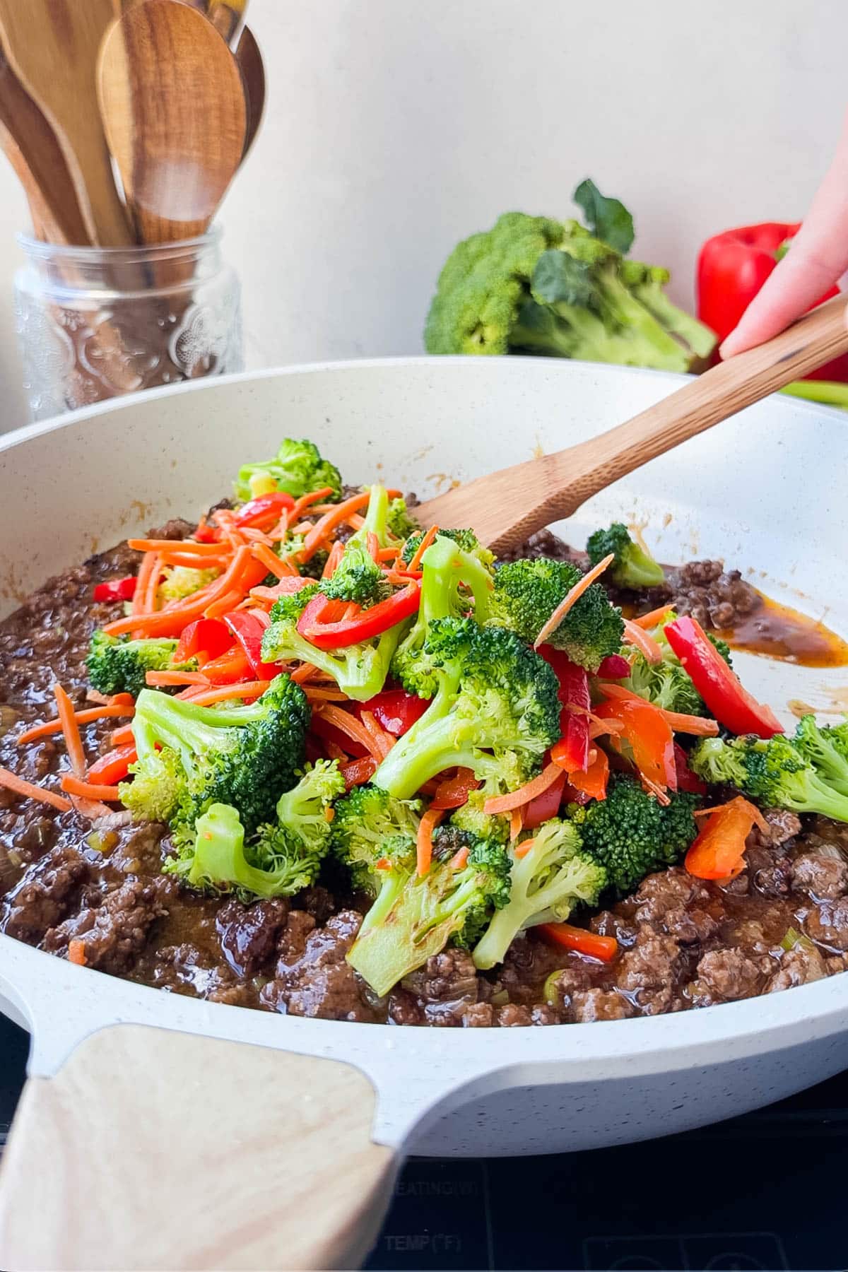 Broccoli, carrots, and peppers stirred into saucy ground beef for an easy ground beef and broccoli dinner