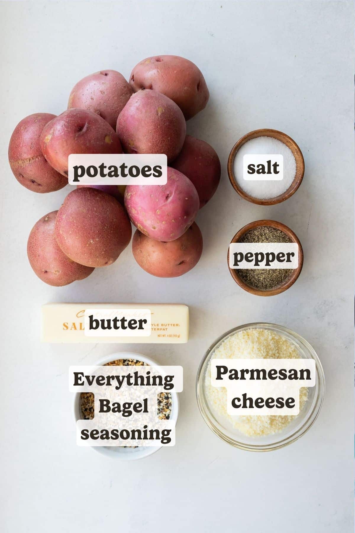 Ingredients for everything bagel parmesan crusted potatoes: red potatoes, salted butter, everything bagel seasoning, grated Parmesan, salt, and pepper
